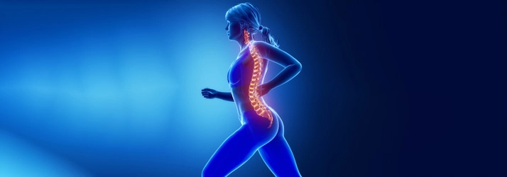 Medical illustration of a person in motion with the spinal column highlighted against a blue background.